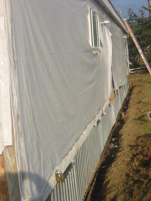 Stucco 3 Panels have been hung from a couple of homes that will get a one-coat stucco over each home and foundation wall.